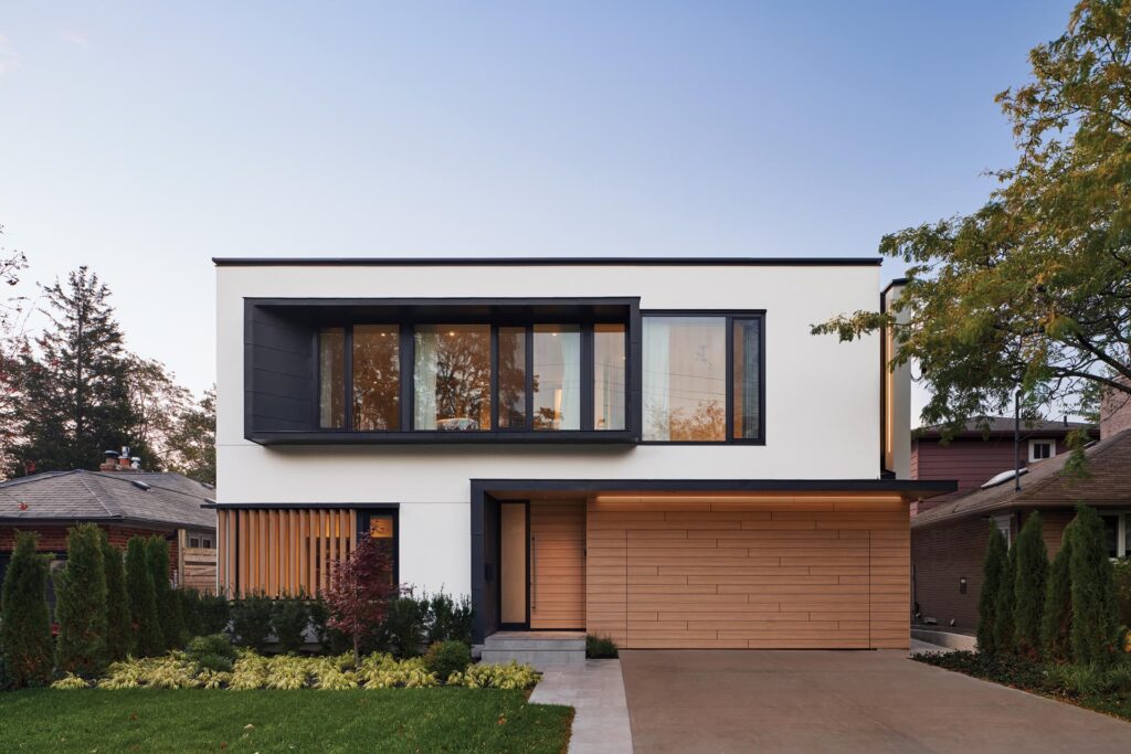 a house with a driveway and a lawn