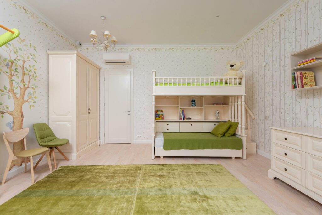 a room with a bunk bed and a green rug